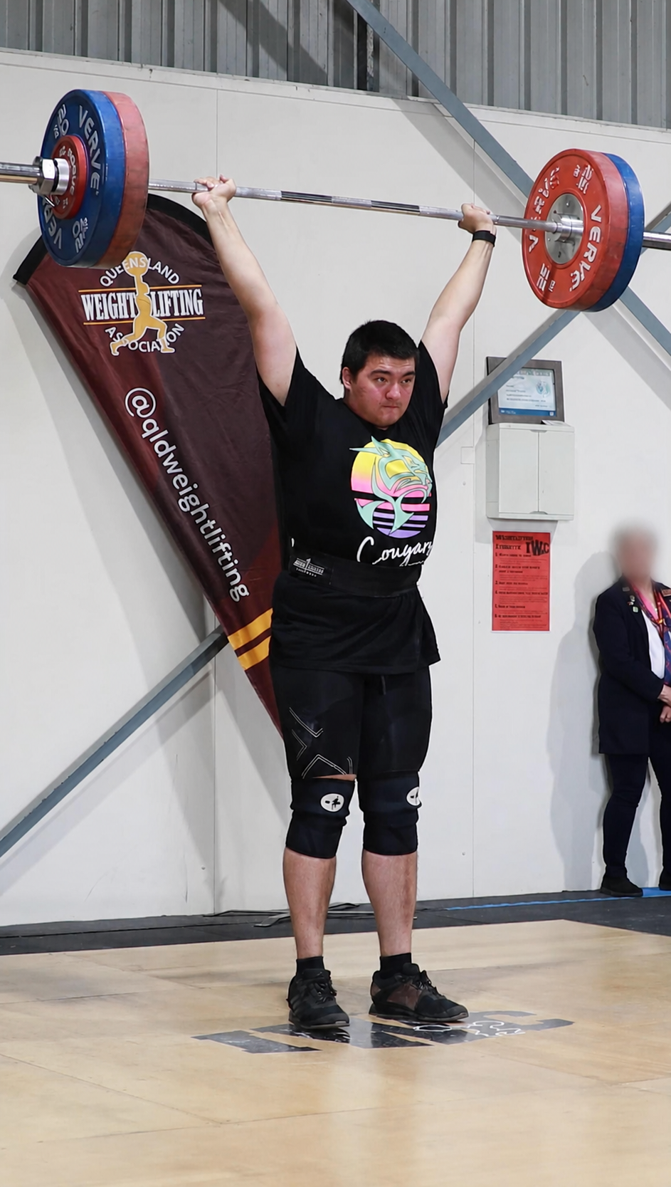 Hilton Im competing on the national weightlifting platform